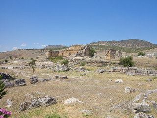 Fototapeta na wymiar Ruins of the ancient city of Hierapolis and blue sky