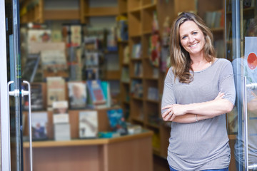 Portrait Of Female Bookshop Owner Outside Store