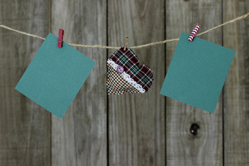 Holiday cards and heart hanging on clothesline
