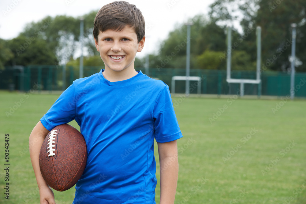 Sticker portrait of boy holding ball on school football pitch