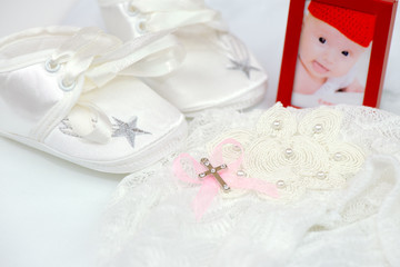Baby girl photo, shoes, cross and hat for christening