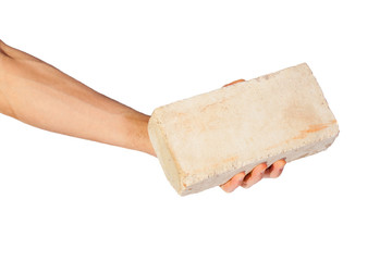 Female hand picking up white brick over white background