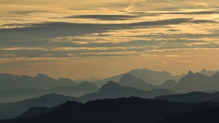 Fototapeta na wymiar Mountain ranges in central Switzerland at sunrise