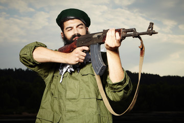 Volunteer with AK-47 handgun 