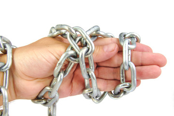 Chained hand of an adult man with strong chain isolated on a