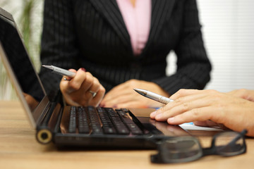 businessman and business woman on meeting analyzing company data