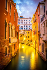 Naklejka premium Narrow canal in Venice in the evening