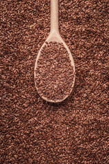 Flax seeds linseed on wooden spoon