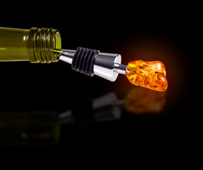 Bottle of Wine with a Stopper from Amber isolated on black background