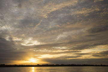 Colorful sunset on the river Amazon in the rainforest, Brazil