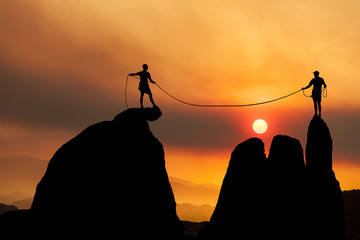 Climbing team on the edge.