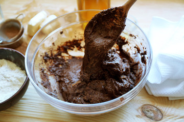 Preparing dough for chocolate pie on table close up