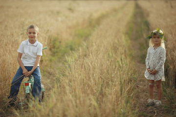 boy playing with a girl in the autumn on the outside