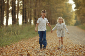 Fototapeta premium Brother and sister Autumn road