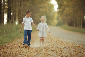 Fototapeta premium Brother and sister Autumn road