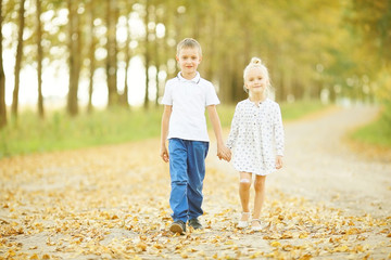 Brother and sister Autumn road