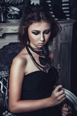 Fototapeta na wymiar Gothic young girl with black rose