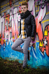 Fashion male portrait on graffiti wall