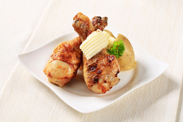 Roast chicken drumsticks and new potatoes