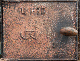 Old rusty metal furnace door