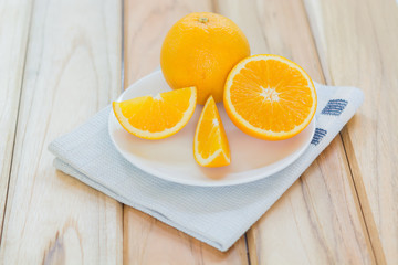 Fresh slices orange fruit with dish