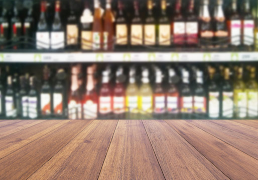wood floor and wine Liquor bottle on shelf - Blurred background