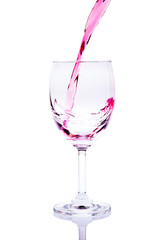 Red Wine Pouring into glass