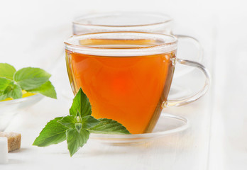 Tea with mint and lemon slices.