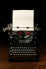 Old vintage typewriter with blank paper © Leigh Prather