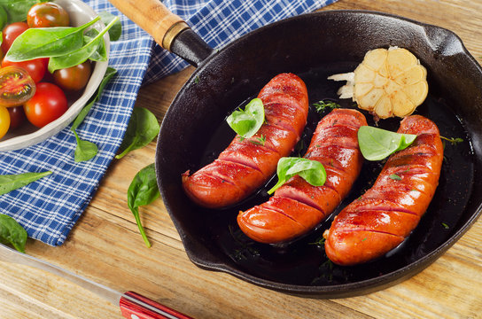 Fried sausages with fresh salad