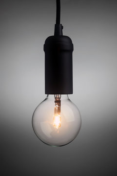 Vintage light bulb glowing