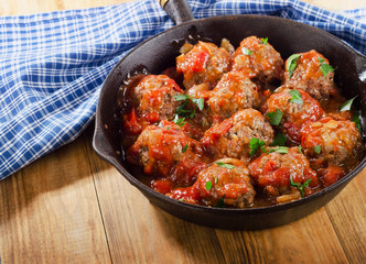 Homemade Meatballs with Tomato Sauce and herbs.
