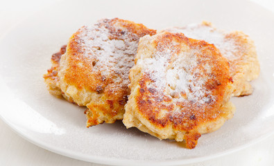 Cottage cheese pancakes with a sugar powder.