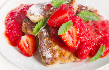 Cottage cheese pancakes with strawberry jam.