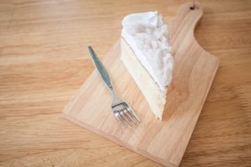 Coconut cake Served on a plate shaped cutting board