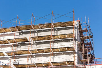 building under renovation with scaffolding