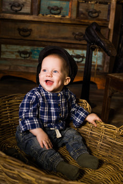 little boy in a basket of rustic rural Provence hilarious, laugh