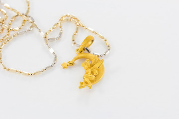 Fototapeta na wymiar Gold necklace pendant fairy