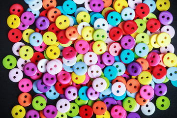 Multicolored buttons on a black background