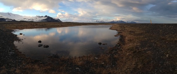 Iceland landscape Panorama with a snowy mountain reflection