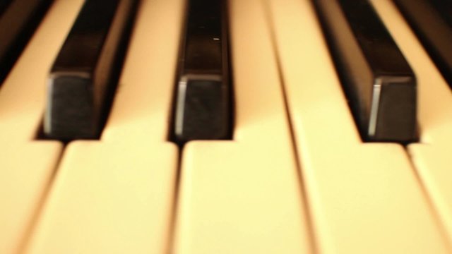 CURRENT SHOT (one of a series):  Faster diagonal dolly down keyboard and back again to 1st position 
