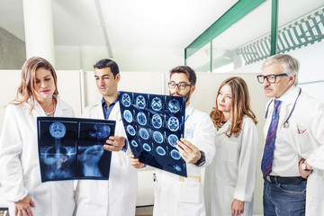 group of doctors examining an x-ray in hospital
