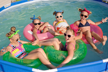 Portrait of children on the pool in summer