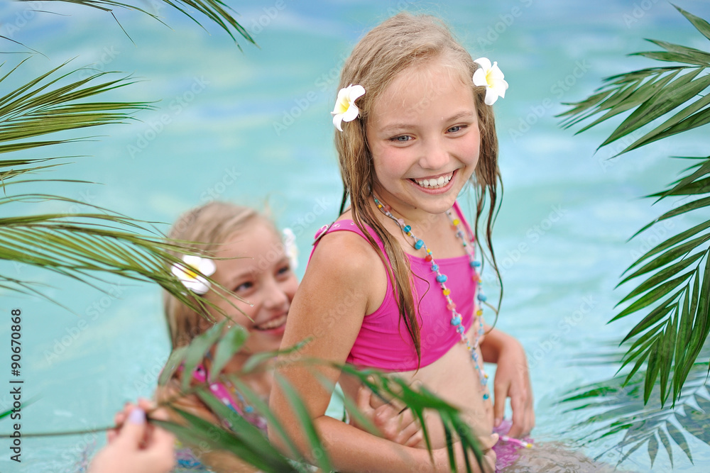 Sticker Portrait of two girls in a swimming pool