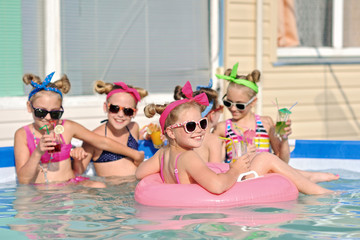 Portrait of children on the pool in summer