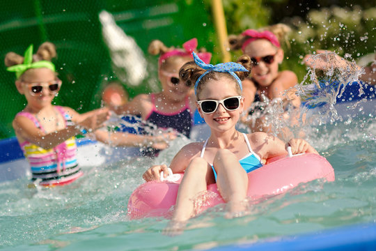 Portrait of children on the pool in summer