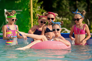 Portrait of children on the pool in summer