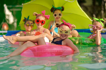 Portrait of children on the pool in summer