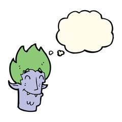 cartoon happy vampire head with thought bubble