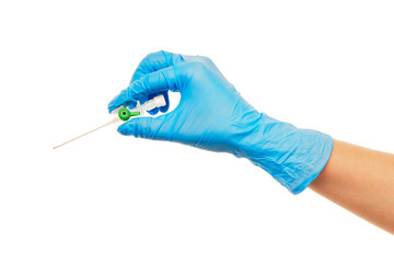 Close up of female doctor's hand in blue sterilized surgical glove with green plastic catheter against white background